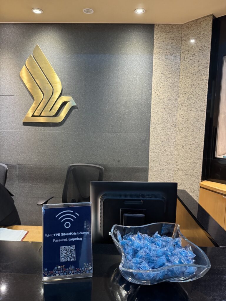 SilverKris Lounge Taipei — entrance and reception with Singapore Airlines branding