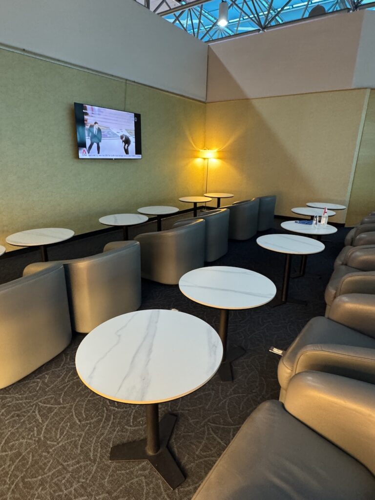 Singapore Airlines SilverKris Lounge Taipei — refined interior with soft lighting and runway views