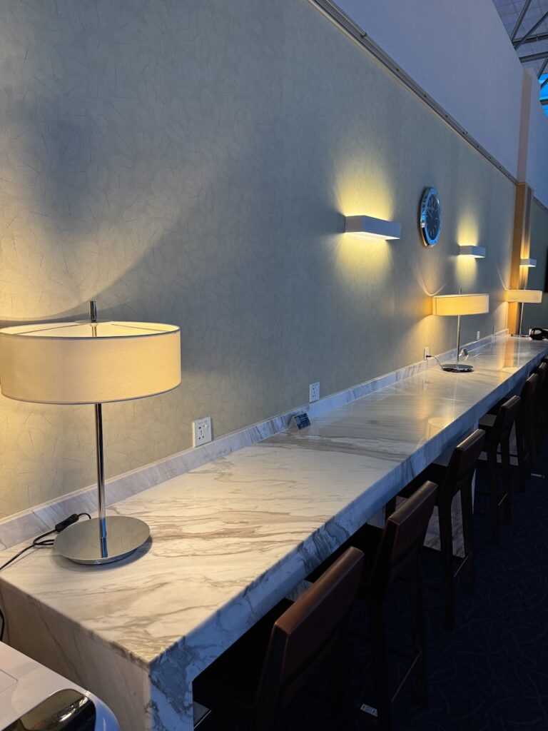 Dining counter — hot dishes, noodle soup station, and SQ ice cream