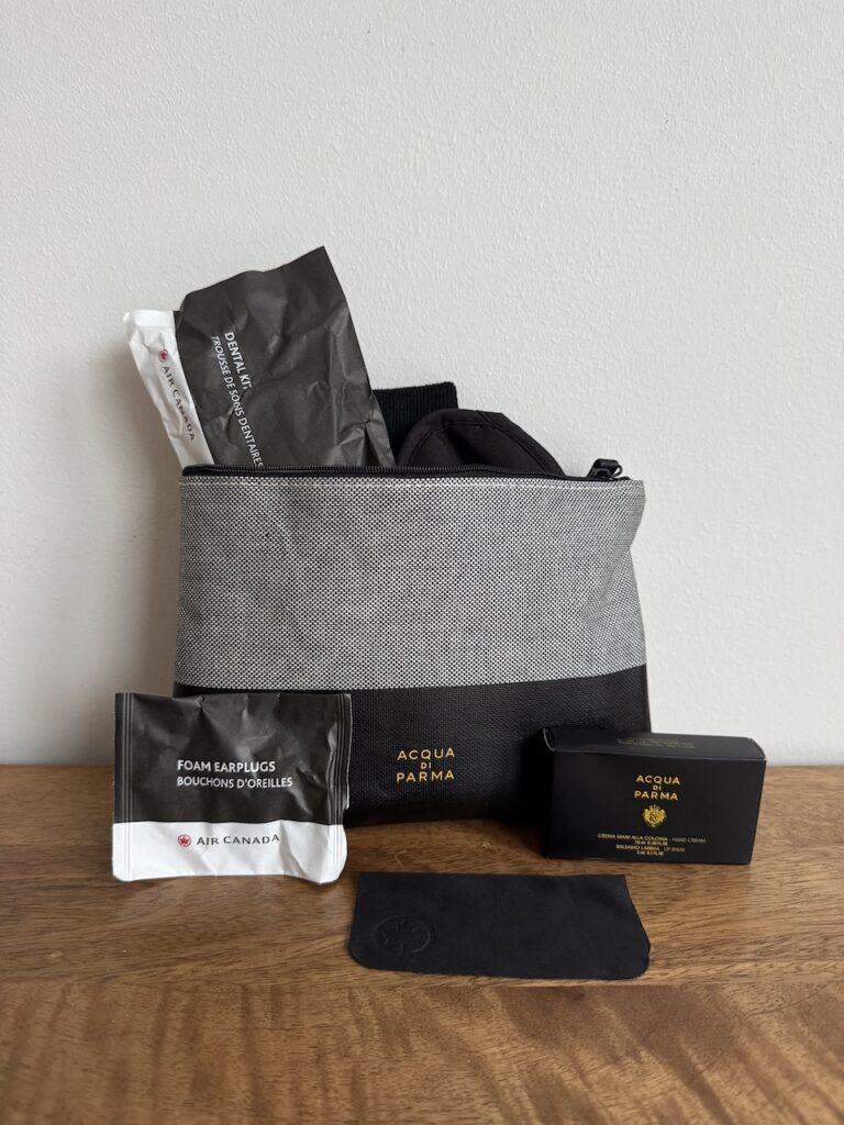 On-request items — sleep mask, lip balm, glasses cloth, and comb