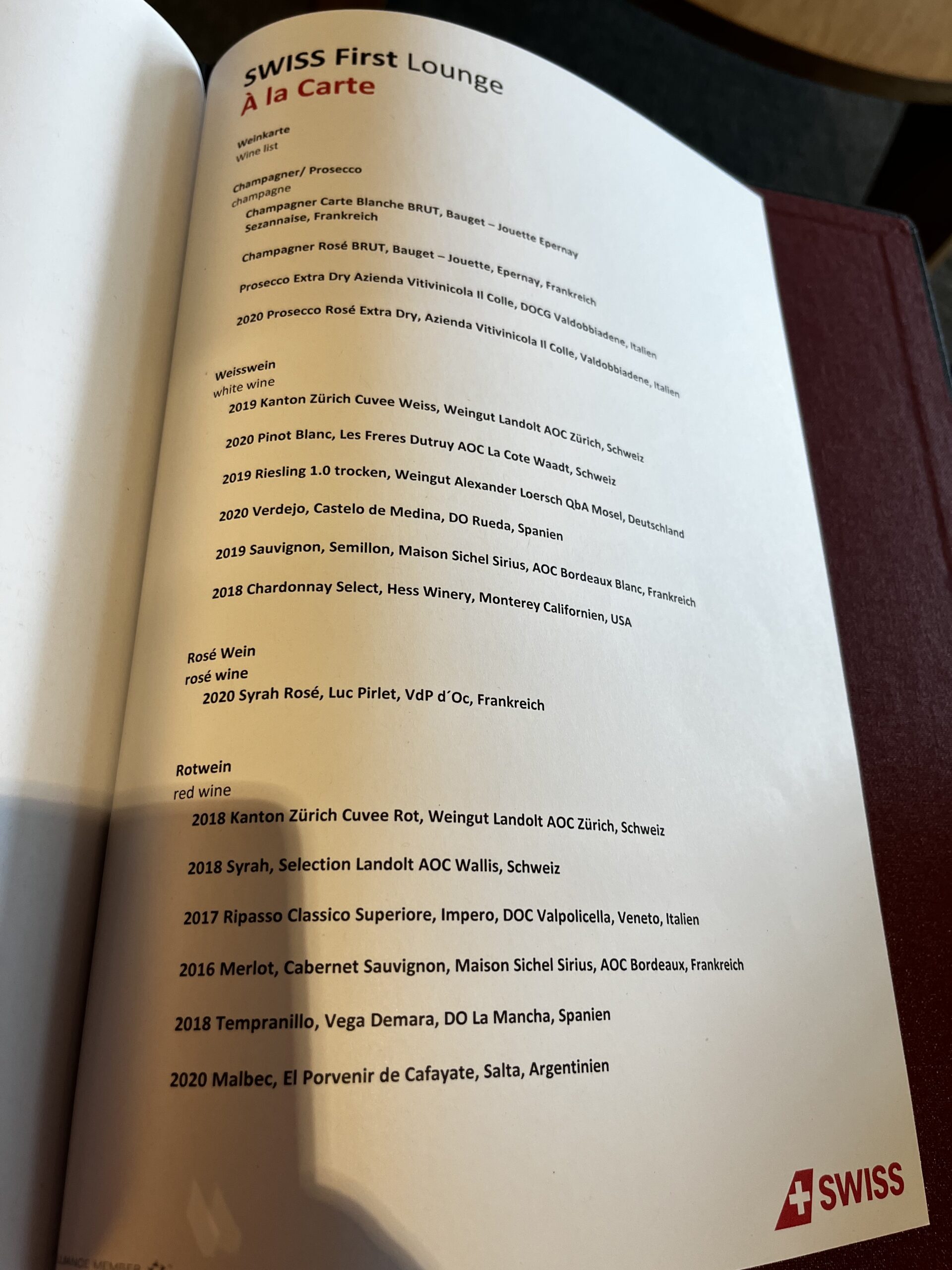 Swiss First Class Lounge Zürich — central seating area with wine humidor and apron views